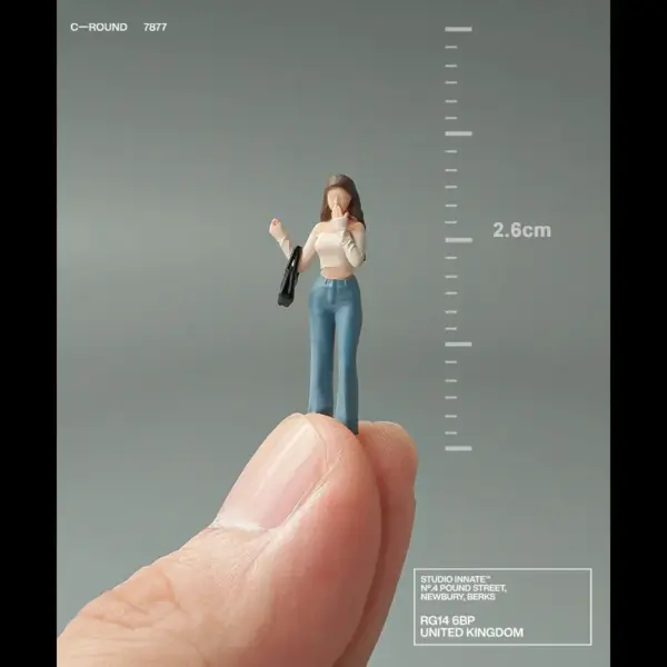 1:64 Scale Miniature Woman with Satchel - Image 3