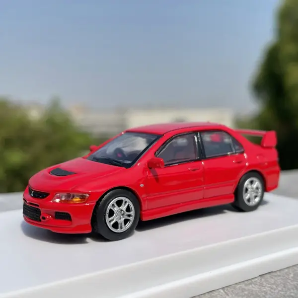 1:64 Scale Blue Mitsubishi Lancer EVO Model - Image 3
