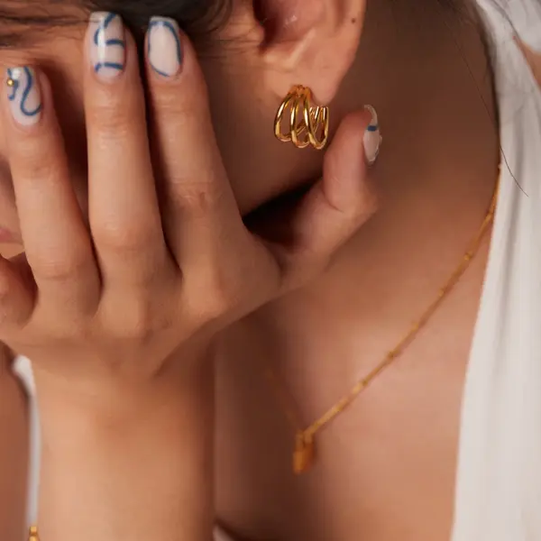 Glossy Three-Line Stud Earrings in Gold - Image 3