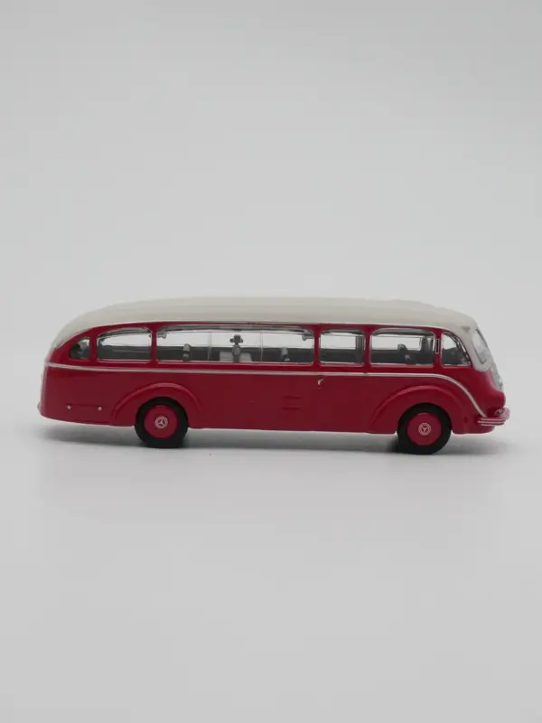 Vintage Red and Cream Diecast Bus Model - Image 3