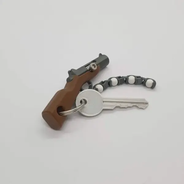 Mini Soft Bullet Gun Keychain Toy - Image 4