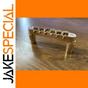 Gold Finish Six-String Guitar Bridge