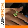 Elegant Stainless Steel Gold Ring with Green Zircons