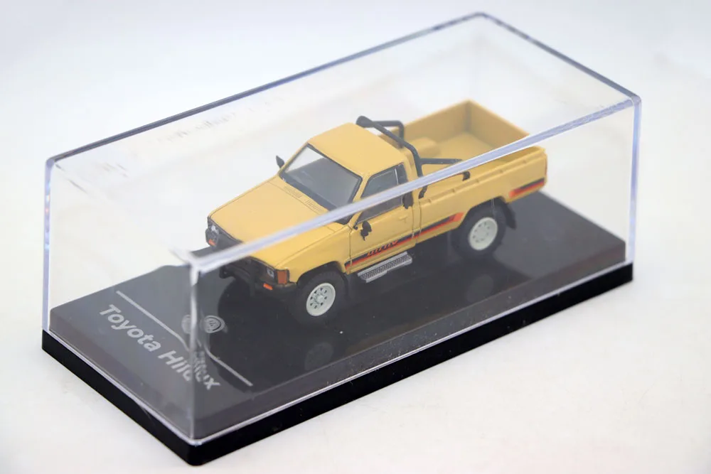 Vibrant Red 1984 Toyota Hilux Diecast Model 7 Vibrant Red 1984 Toyota Hilux Diecast Model - Image 7