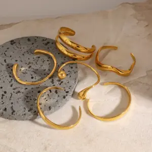 Stainless Steel Gold-Toned Wave Cuff Bracelet 15 S27aa90b264a74ccdaf1d704b3252ac7eo