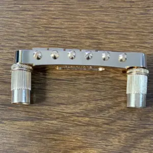 Gold Finish Six-String Guitar Bridge 10 S36e37714589649a7ba0caa7261b0a4a0q