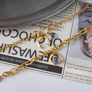 Gold Stainless Steel Bracelet with Blue Horseshoe Pendant 12 S38336fedb10740579760ad027ba195c6T