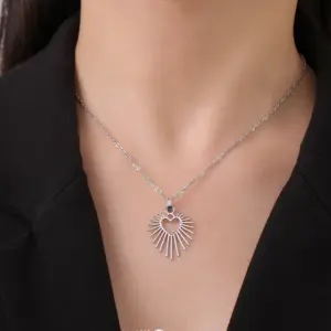Stainless Steel Sunburst Heart Necklace 9 S8e36ddef41674343938482469a3e257cr