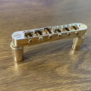 Gold Finish Six-String Guitar Bridge 7 S93c5aea7578e469c83ff3d8e91e2c3837
