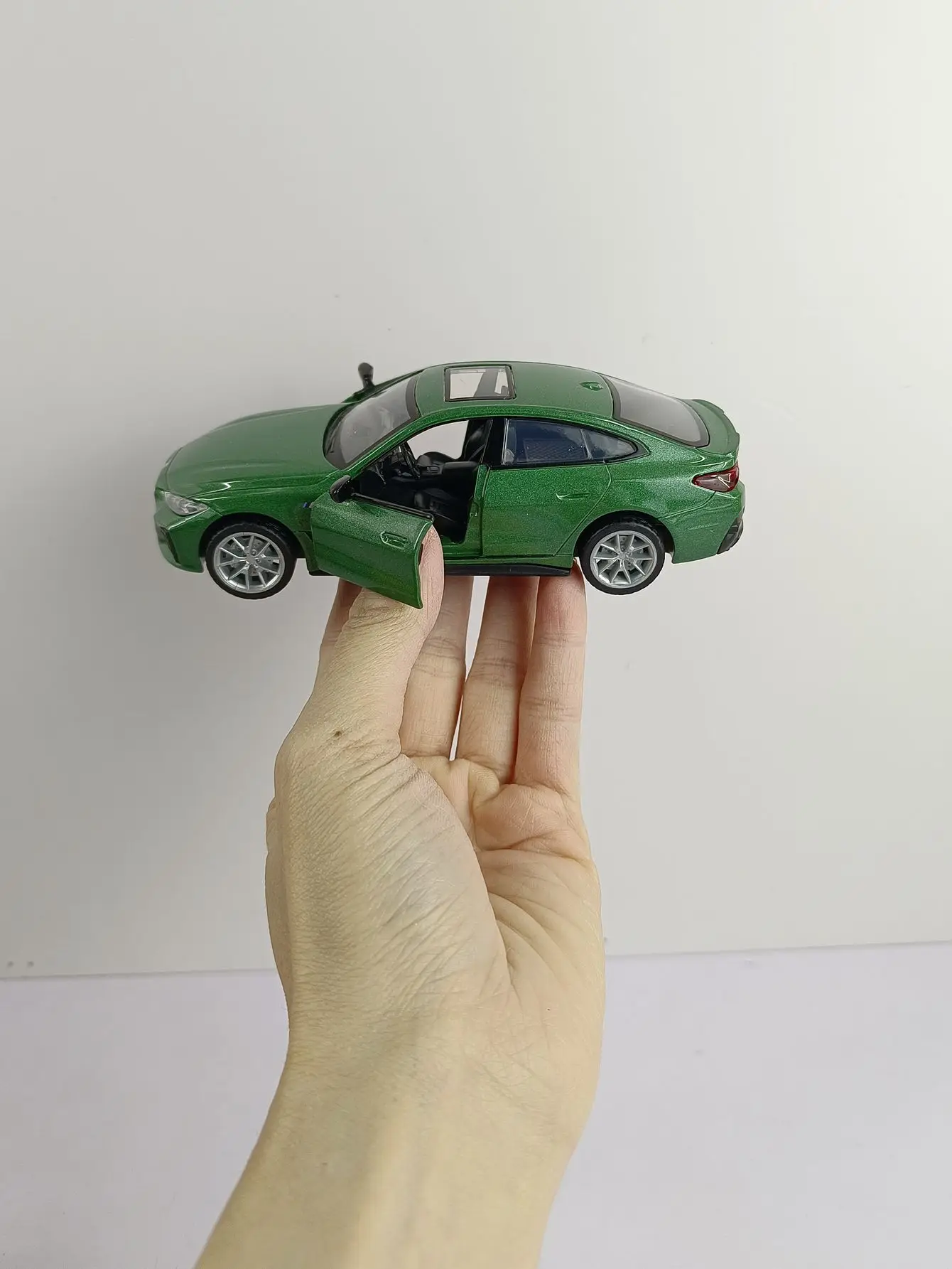 BMW I4 M50 Diecast Model 1:34 Scale with Charging Station 6 BMW I4 M50 Diecast Model 1:34 Scale with Charging Station - Image 6