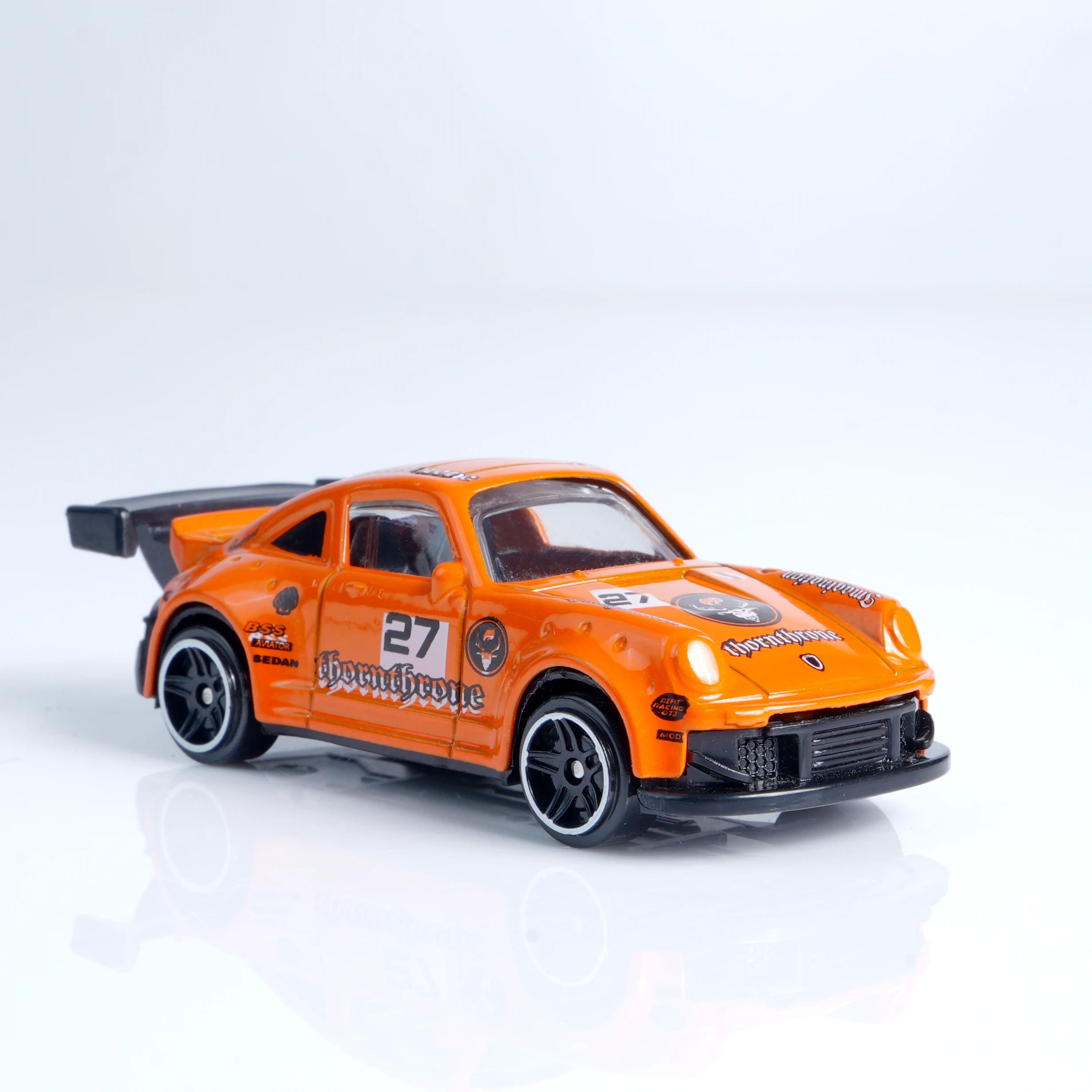 Vibrant 1:64 Orange Die-Cast Racing Car 4 Vibrant 1:64 Orange Die-Cast Racing Car - Image 4
