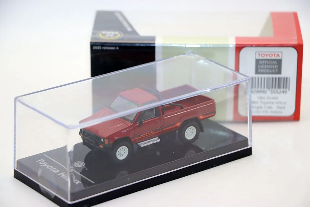 Vibrant Red 1984 Toyota Hilux Diecast Model 6 Vibrant Red 1984 Toyota Hilux Diecast Model - Image 6