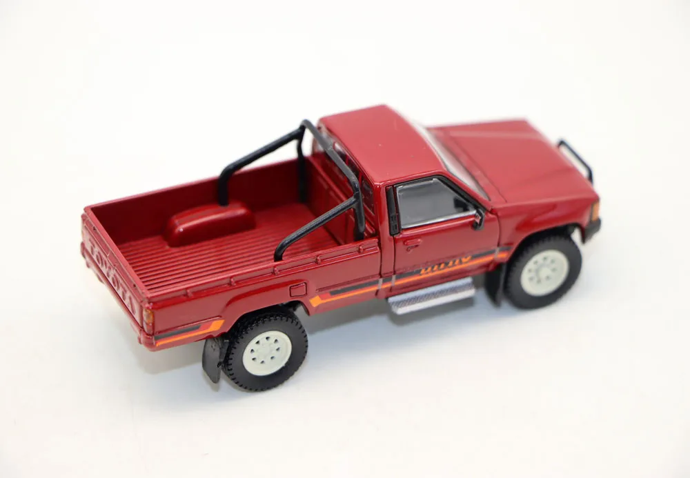 Vibrant Red 1984 Toyota Hilux Diecast Model 4 Vibrant Red 1984 Toyota Hilux Diecast Model - Image 4