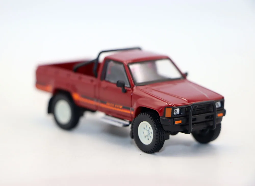 Vibrant Red 1984 Toyota Hilux Diecast Model 2 Vibrant Red 1984 Toyota Hilux Diecast Model - Image 2