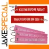 Kiss Me Before Flight Keychain in Red or Pink