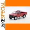 Vibrant Red 1984 Toyota Hilux Diecast Model
