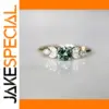 Gold Women's Ring with Green Gem and Zircon Accents