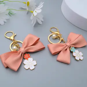 Pink Satin Bow Keychain with Enamel Flowers 12 S09fe42ebeb4f47e086ab6ea26ba9935f7