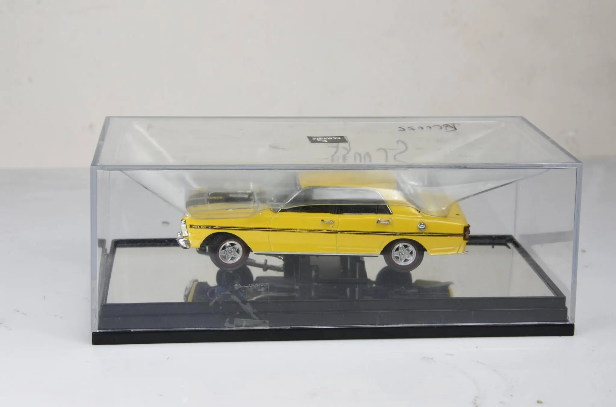 Vibrant Yellow Vintage Diecast Car in Organic Glass 2 Vibrant Yellow Vintage Diecast Car in Organic Glass - Image 2