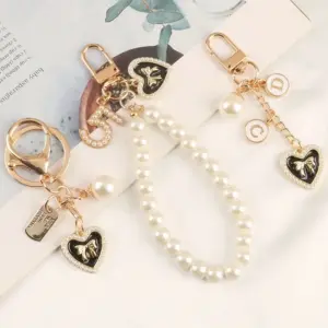 Pearl Heart Keychain with Camellia Bowknot 15 S6fc388e808e24eb2811c52e9158b4cdfn