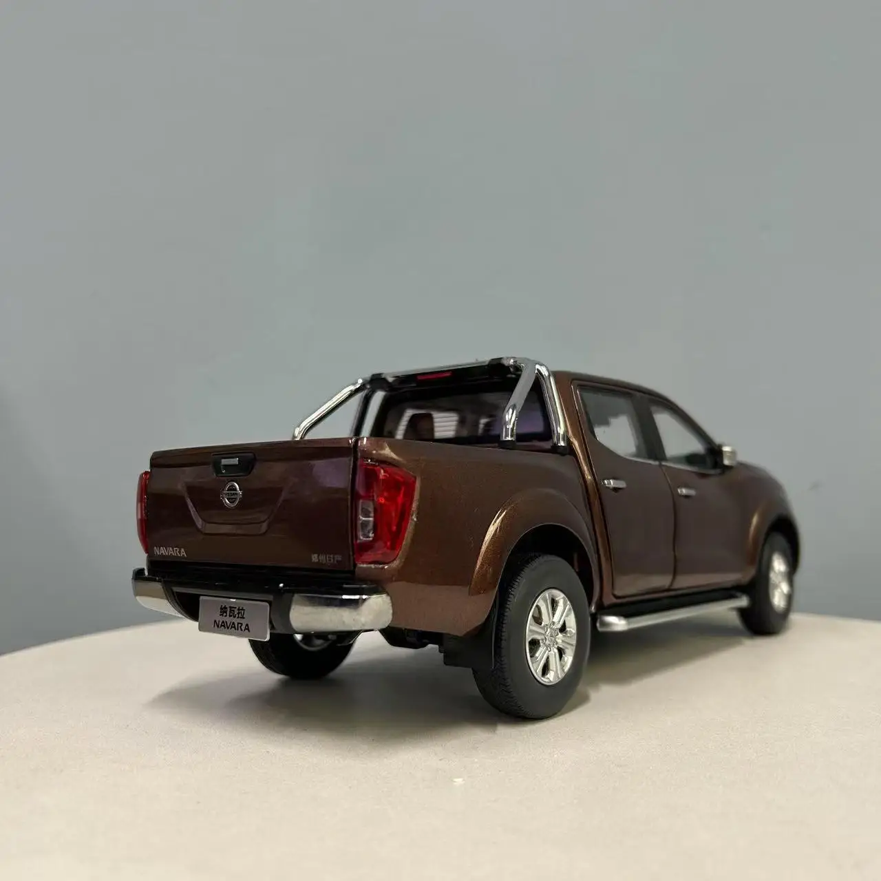 1:18 Nissan Navara Pickup Model in Metallic Brown 2 1:18 Nissan Navara Pickup Model in Metallic Brown - Image 2