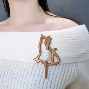 Wooden Brooch with Animal Motifs