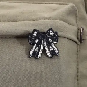 Gothic Dark Bow Brooch with Skull Motifs