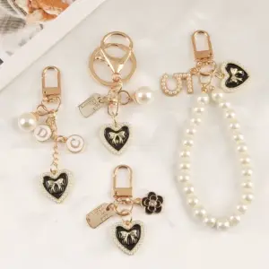 Pearl Heart Keychain with Camellia Bowknot