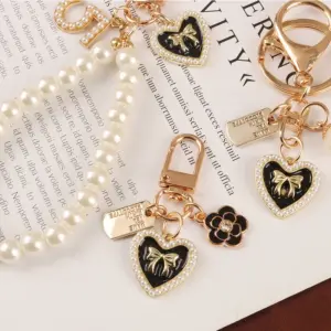 Pearl Heart Keychain with Camellia Bowknot 13 Se353a0ee99834b4993bb1fd3985670b8e