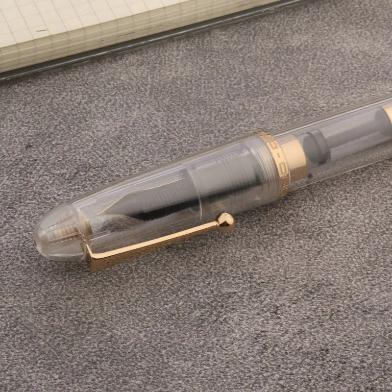 Transparent White Acrylic Fountain Pen with Gold Accents 5 Transparent White Acrylic Fountain Pen with Gold Accents - Image 5