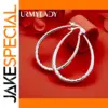 Silver Teardrop Hoop Earrings with Textured Pattern