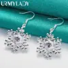 Elegant Sterling Silver Snowflake Earrings with Purple Zircon