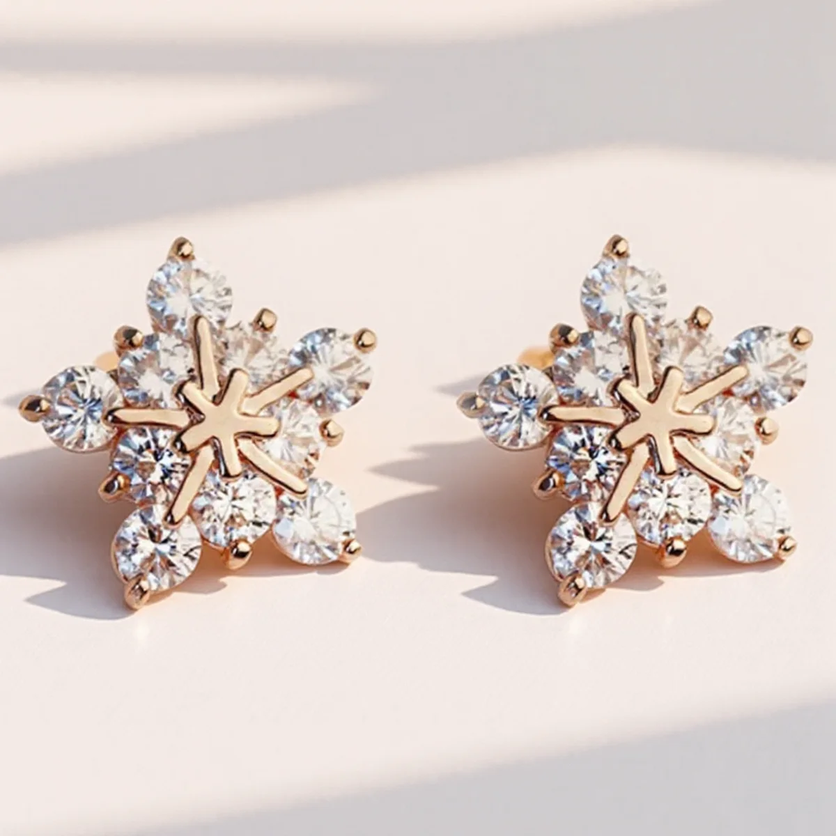 Elegant Snowflake Stud Earrings in Rose Gold 2 Elegant Snowflake Stud Earrings in Rose Gold - Image 2