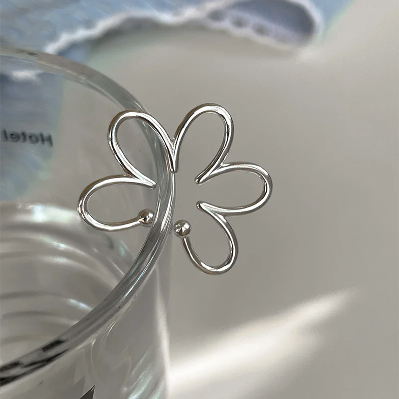 Stylish Silver Flower Clip Earrings 3 Stylish Silver Flower Clip Earrings - Image 3