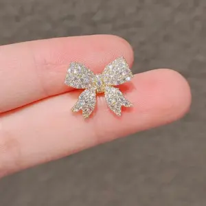 Elegant Gold-Toned Bowknot Brooch with Rhinestones 10 S98ea438d08a748d580283dd24710fb2dO