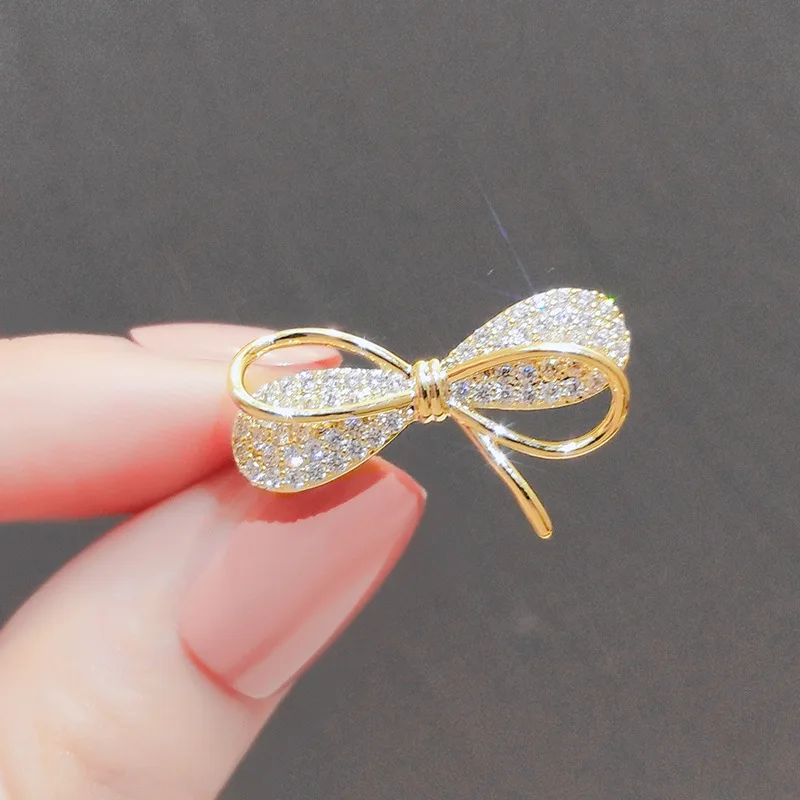 Elegant Gold-Toned Bowknot Brooch with Rhinestones 8 Elegant Gold-Toned Bowknot Brooch with Rhinestones - Image 8